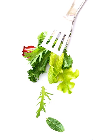 Fresh salad leaves and herbs isolated on white backgroundの写真素材