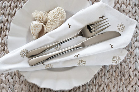 Seaside theme table setting with shells and coral