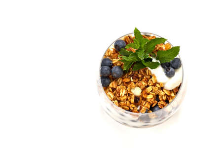 Natural yogurt with berries and muesli isolated on white background with space for textの写真素材