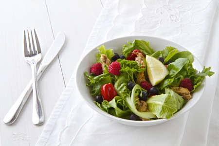 Salad with cutlery and linenの写真素材