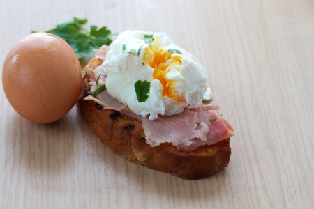 Poached egg and ham on toasted ciabatta with space for text