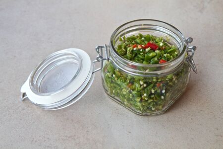 Chillies prepared and chopped ready to make salsaの写真素材
