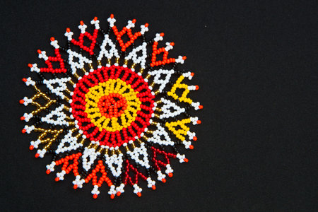 Beaded African design pattern with space for text