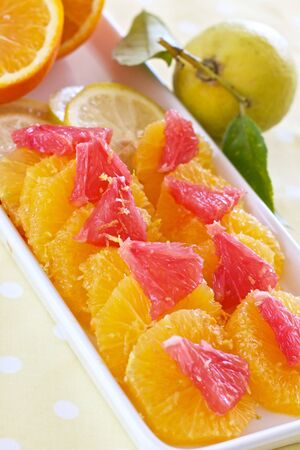 Grapefruit and oranges sliced for a healthy mealの写真素材