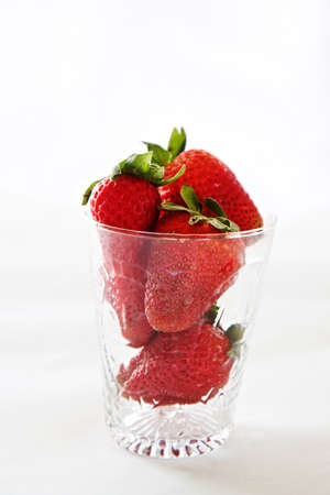 Strawberries in a glass and isolated with space for textの写真素材
