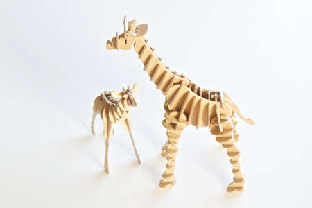 Crafted wooden animal toys isolated on a white backgroundの写真素材