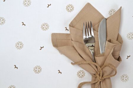 Natural linen napkin with knife and forkの写真素材