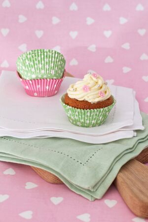Cupcakes decorated with vanilla frosting の写真素材
