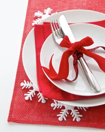 Christmas table place setting in red and whiteの写真素材
