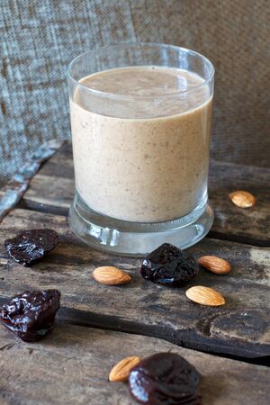 Healthy Smoothie drink with oats prunes and almondsの写真素材