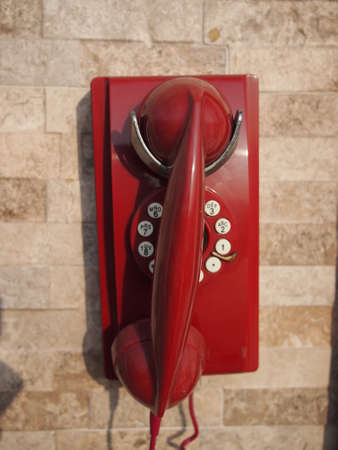 An old red telephoneの写真素材