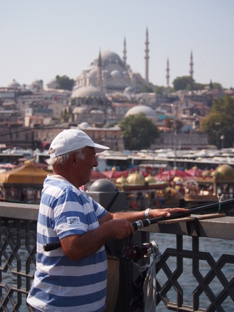 Istanbul, Turkey - September 27, 2015: Local fisherman at work on a sunny day on Galata Bridge in Istanbul.のeditorial素材