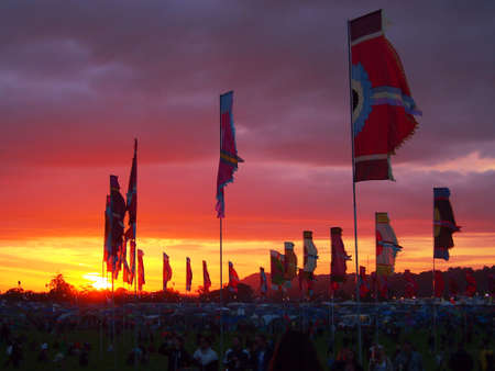 Pilton, United Kingdom - June 24, 2015: Festival Flags at sunsetのeditorial素材