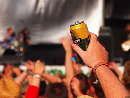 Pilton, United Kingdom - June 28, 2015: Music Festival crowd enjoy cider in the sunのeditorial素材