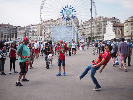 Marseille, France - June 30, 2016: Portugal fans playing football and doing kick-ups in the old port of Marseille before their quarter final against Polandのeditorial素材