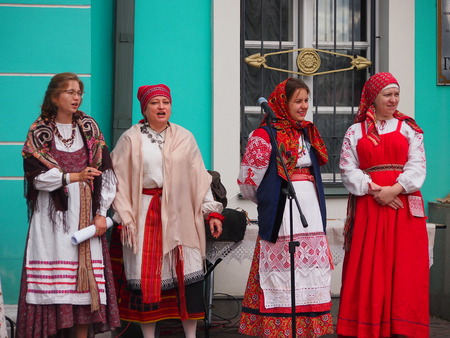 Moscow, Russia - September 11, 2016: Four women sing and dance traditional Georgian folk songs outside a Georgian cultural centre in Moscow.のeditorial素材
