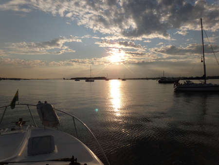Coming sunset on waterの写真素材