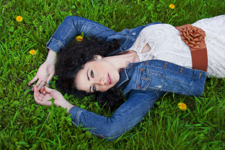 Woman relaxing on the meadowの写真素材