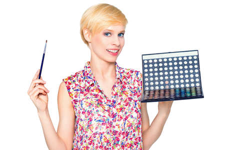 Artis with makeup brushes and palette of eyeshadowsの写真素材