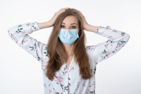 Woman with face mask isolated on the white background after covid-19 lockdown