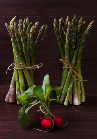Green asparagus and radishesの写真素材