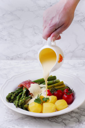 Green asparagus on a plateの写真素材