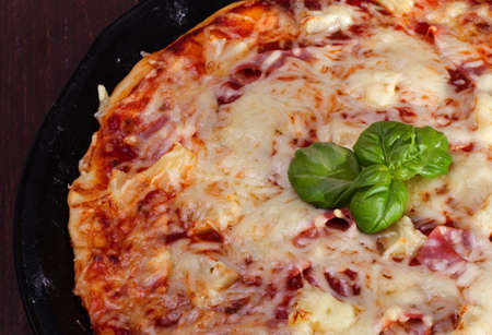 Pizza Hawaii with ham and pineappleの写真素材