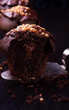 Chocolate muffins on a dark backgroundの写真素材
