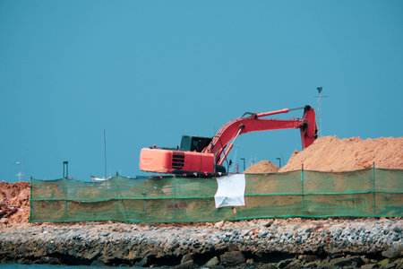 Excavators are building roads to reach the sea.