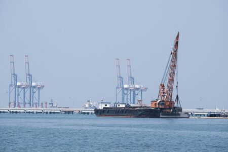 Sand tanker at the sand loading station with loaderの写真素材
