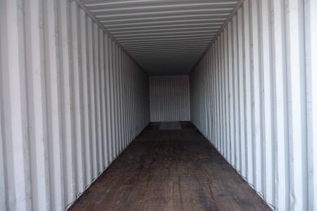 Inside empty dry high cube container with wooden floorの写真素材