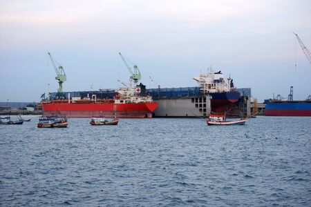 Large pier and shipyard Perspective of staying together with fishing boatsの写真素材