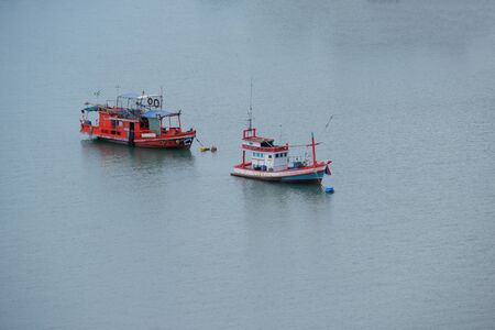 Small fishing in the middle of the seaの写真素材