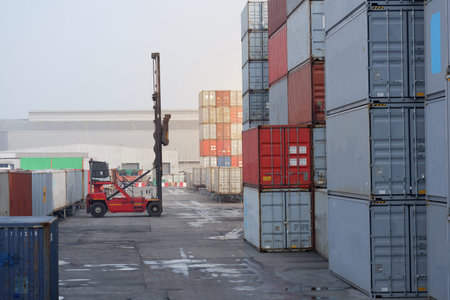 a pile of container in freight yard against a blue sky, transport background