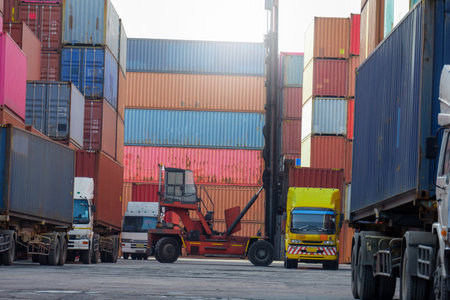 Container forklifts and container delivery trucks for packaging and transportationの写真素材