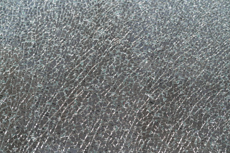 Large area of broken glass creating a pattern
