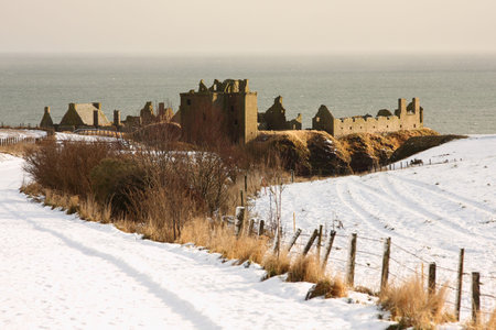 Dunnottar Castle with snow on the ground, Scotlandの写真素材