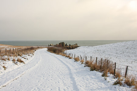 Dunnottar Castle with snow on the ground, Scotlandの写真素材