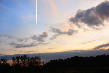 The effects of the sunset reflected on the autumn skyの写真素材