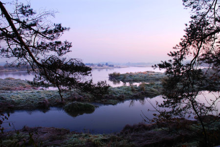 Photographed autumn sunrise over the river Bugの写真素材