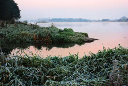 Photographed autumn sunrise over the river Bugの写真素材
