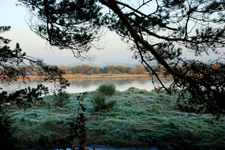 Photographed autumn sunrise over the river Bugの写真素材