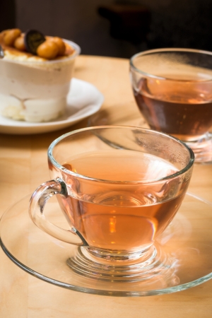 Tea and cupcake on tableの写真素材