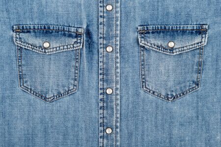 Denim shirt, two side pockets as background.の写真素材