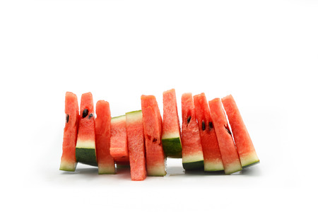 Watermelon slices stacked vertically isolated on white background with space for text.の写真素材