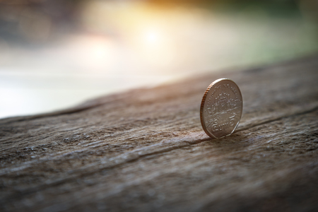 Coin set on old wooden with shiny sunlight background. Thai coin 5 baht.の写真素材
