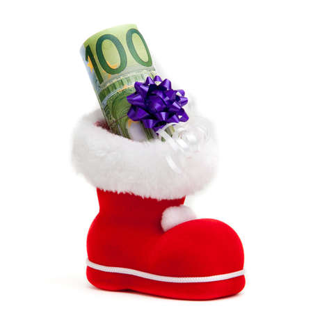 Euro in boot of Santa Claus on white background の写真素材