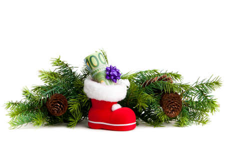 Euro in boot of Santa Claus on white background の写真素材