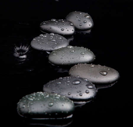 Spa Stones. shiny zen stones with water dropsの写真素材