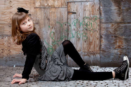 young happy girl.  little girl on a gray backgroundの写真素材
